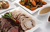 Sliced roast beef and roast pork with accompaniments