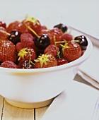 Strawberries, raspberries and cherries in a bowl