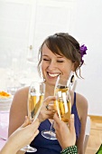 Young woman drinking champagne