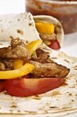 Fajitas filled with pork and peppers