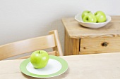 Granny Smith apple on a plate