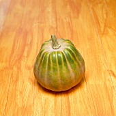 An ornamental gourd on orange background
