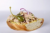 Baguette topped with tuna and caper