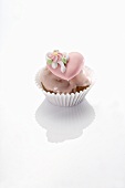 Cupcake with pink icing and sugar heart