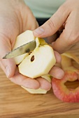 Cutting an apple into quarters