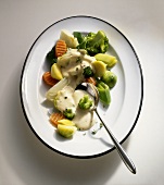 Steamed vegetables with cheese sauce