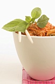 Asian dish in a bowl with chopsticks