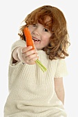 Small girl with carrot