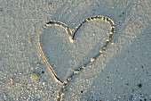 Heart drawn in sand