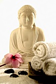 Buddha statue with pink cyclamen & hematite (healing stones)