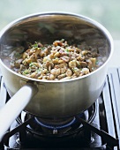 Making mushroom risotto in a pan