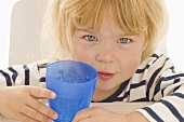 Little girl with beaker of water