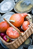 Squashes and apples in a basket