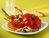 Tomatoes stuffed with prawns, avocado and olives