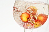 Sweet cherries in a glass of water