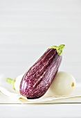Two aubergines (purple and white)