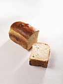 A loaf of white bread, sliced