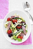 Pasta salad with ham and vegetables, seen from above