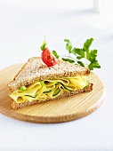 A cheese and gherkin sandwich on wholemeal bread