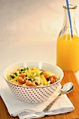 Couscous salad with vegetables and orange juice