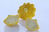 Yellow patty pan squash, whole and halved