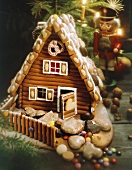 A gingerbread house with a nutcracker