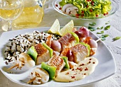Fish and seafood kebabs with wild rice