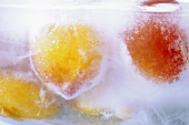 Frozen peaches in a block of ice
