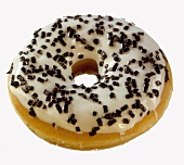 Doughnut decorated with glacé icing and chocolate sprinkles