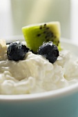 Cottage cheese with blueberries & kiwi fruit in a small bowl