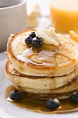 Pancakes with butter and blueberries for breakfast