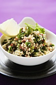 Pearl barley salad with parsley in a bowl