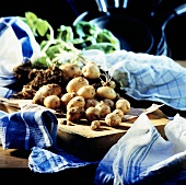 Freshly dug potatoes on chopping board