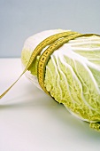 Chinese cabbage with tape measure around it