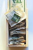 Tea Bags in an Opened Wooden Box; From Above