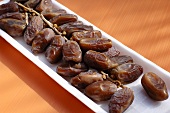 Dried dates in a polystyrene tray