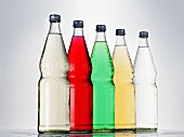 Five bottles of different fizzy drinks