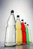Five bottles of different fizzy drinks