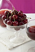 Cherries in a stemmed glass bowl