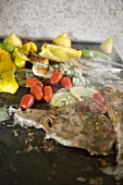 Fish and seafood with vegetables on grill plate