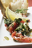 Chard and tomatoes with lemon and white bread