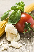 Tomato with spaghetti, Parmesan and basil