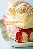 Puff pastries filled with raspberry ice cream & raspberry sauce