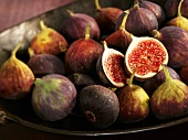 A bowl of whole and halved figs