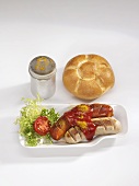 Red & white currywurst (sausages with ketchup & curry powder), bread roll