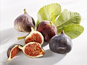 Three whole figs and one cut into pieces