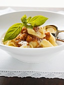 Tortellini with mince sauce, Parmesan and basil
