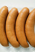 Four bockwurst (German sausages) in a plastic tray
