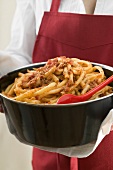 A pot of macaroni with meat and tomato sauce