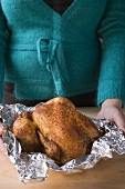 A roast chicken in aluminium foil
